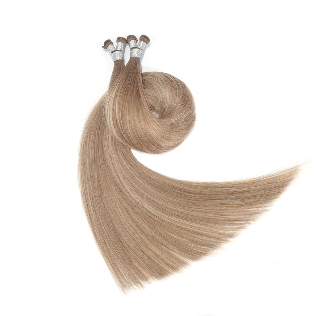 Two bundles of GENIUS WEFT Hair Extensions 7-Star Full Cuticle Remy Hair in brown and hazelnut colors