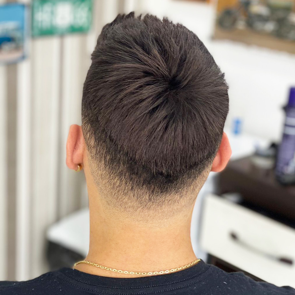 Back view of a man wearing a LIGHT03 thin skin hair system